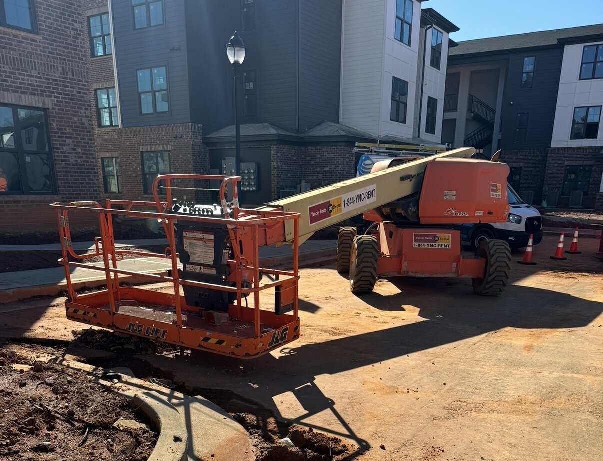 Rented telescopic boom lift coordinated to the jobsite