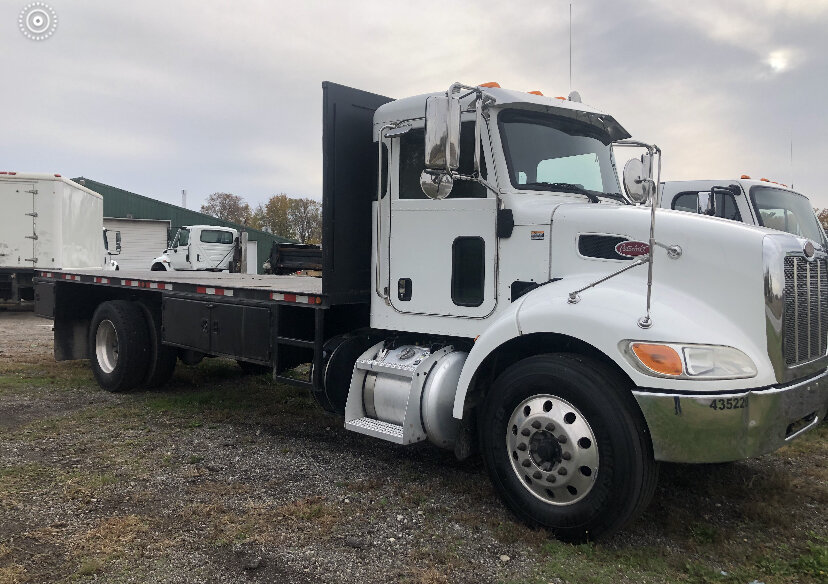 Flatbed truck for equipment and material transport